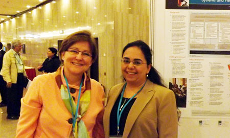 Image of Karen Hardee and Laili Irani at Health Systems Research symposium in Beijing.