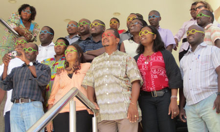 Photo of HPP workshop participants wearing their gender lenses?a tool from the workshop to encourage participants to view their projects, as well as their community and society in general, with an eye on gender.