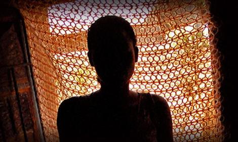 Image of an HIV-positive woman's silhouette in doorway
