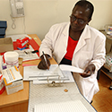 Kenyan woman doctor in a clinic setting 
