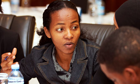 Hon. Alemtsehay Paulos, a member of Parliament from Ethiopia, talks with her country delegation during an advocacy skills training session at the HPP-sponsored Women Parliamentarians Meeting: Enhancing Leadership for Family Planning and Reproductive Health in Kampala, Uganda in August 2012. 