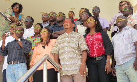 Photo of HPP workshop participants wearing their gender lenses?a tool from the workshop to encourage participants to view their projects, as well as their community and society in general, with an eye on gender. 