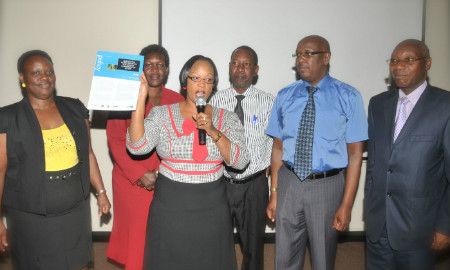 Image of Ugandan parliamentarians launching new policy brief on family planning.